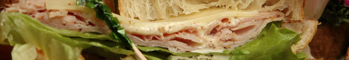 Eating Deli Sandwich at Lee's Deli Shop restaurant in Columbia, MD.